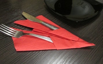 how to fold the napkin beautifully in the photo